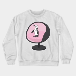 African Penguin Sitting on a Pink Egg Chair Crewneck Sweatshirt